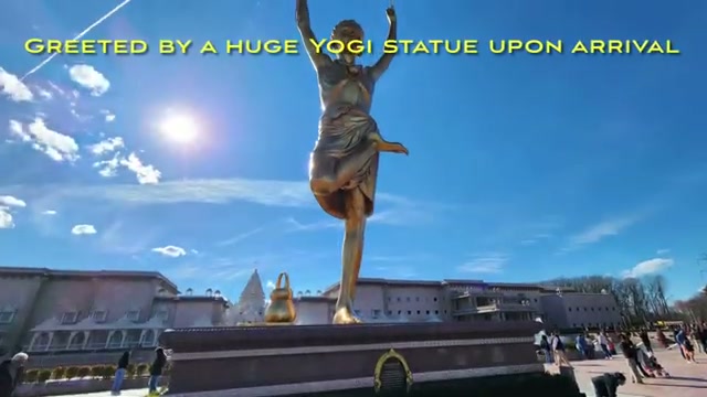 The huge golden yogi statue that greets visitors on arrival