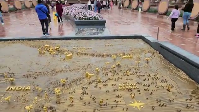 Bronze relief map of India with golden temple markers