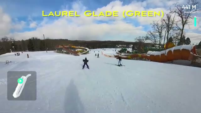 Skiing down Laurel Glade (Green) with the trail label on screen