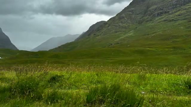 The Glencoe valley between the peaks — the video’s cleanest wide shot