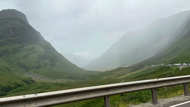 Misty green mountains from a Glencoe roadside pullout