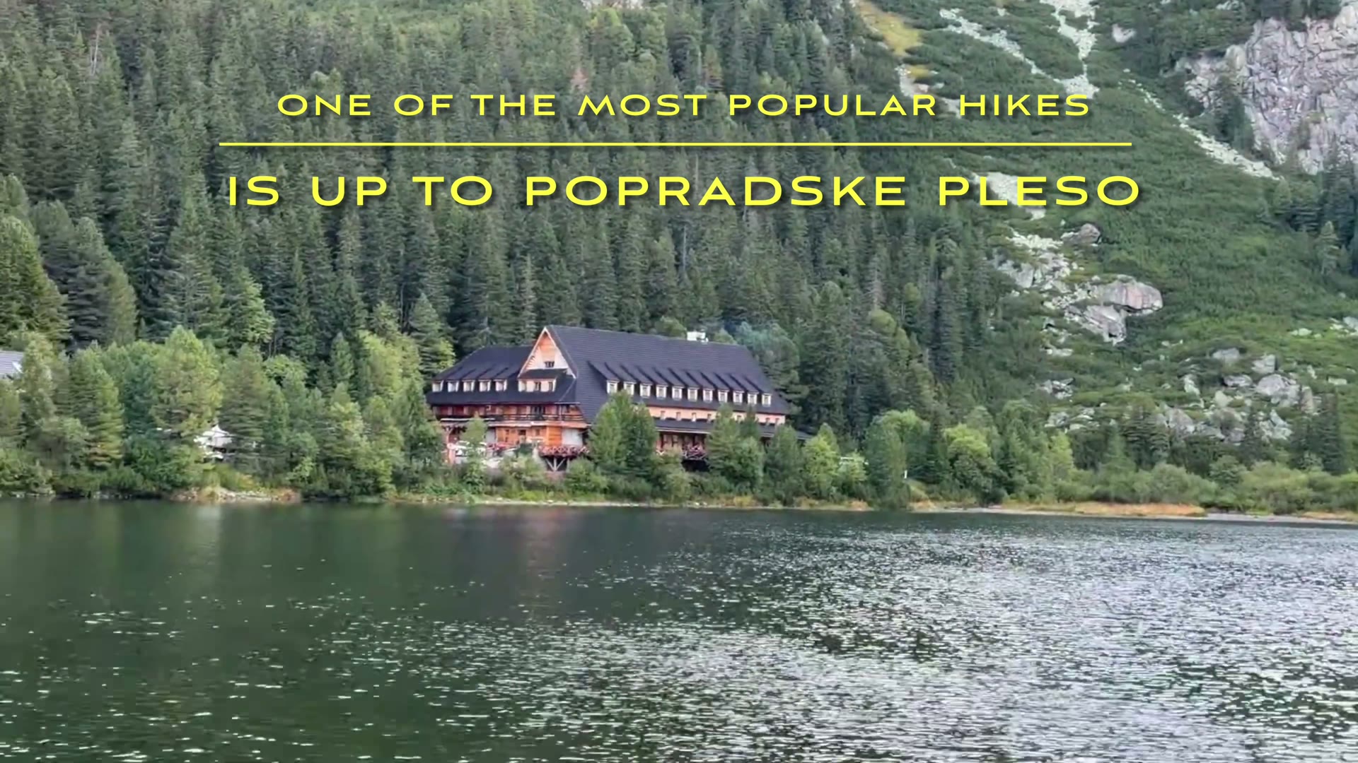 Mountain chalet on the shore of Popradské pleso, backed by forest and rocky slopes
