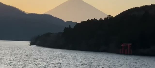 Sunset over Lake Ashi, with Mt Fuji silhouetted and the torii gate on the far shore