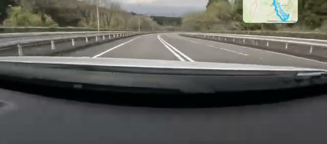 Mt Fuji looming over the road to Fujiyoshida