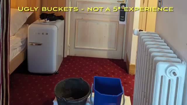 Buckets in the room catching a leak β not a 5-star experience