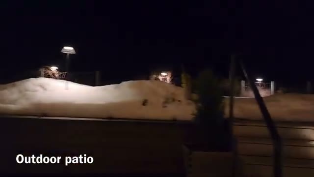The hotel’s outdoor patio at night, overlooking Selva di Val Gardena