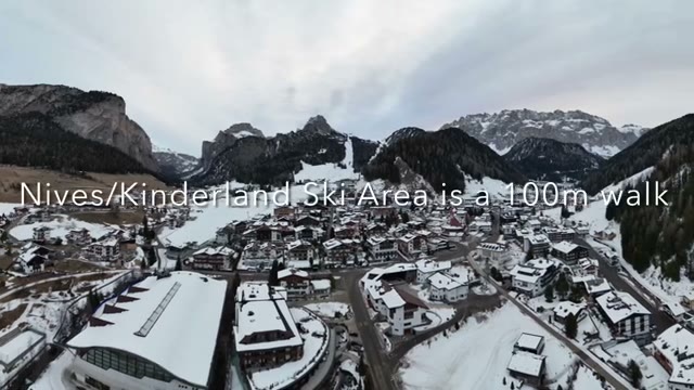 Snow-covered Selva di Val Gardena with the Kinderland ski area a short walk away
