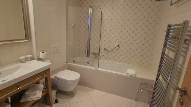 The bathroom with tub and shower