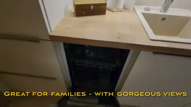 The kitchenette with dishwasher and coffee pods