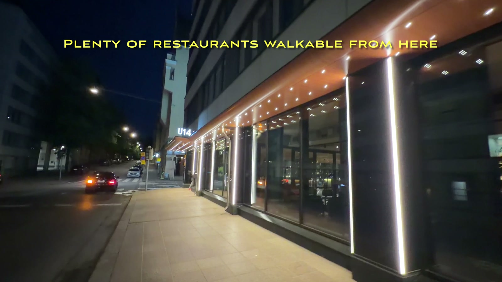 Hotel U14’s storefront at night, with plenty of restaurants walkable from the entrance