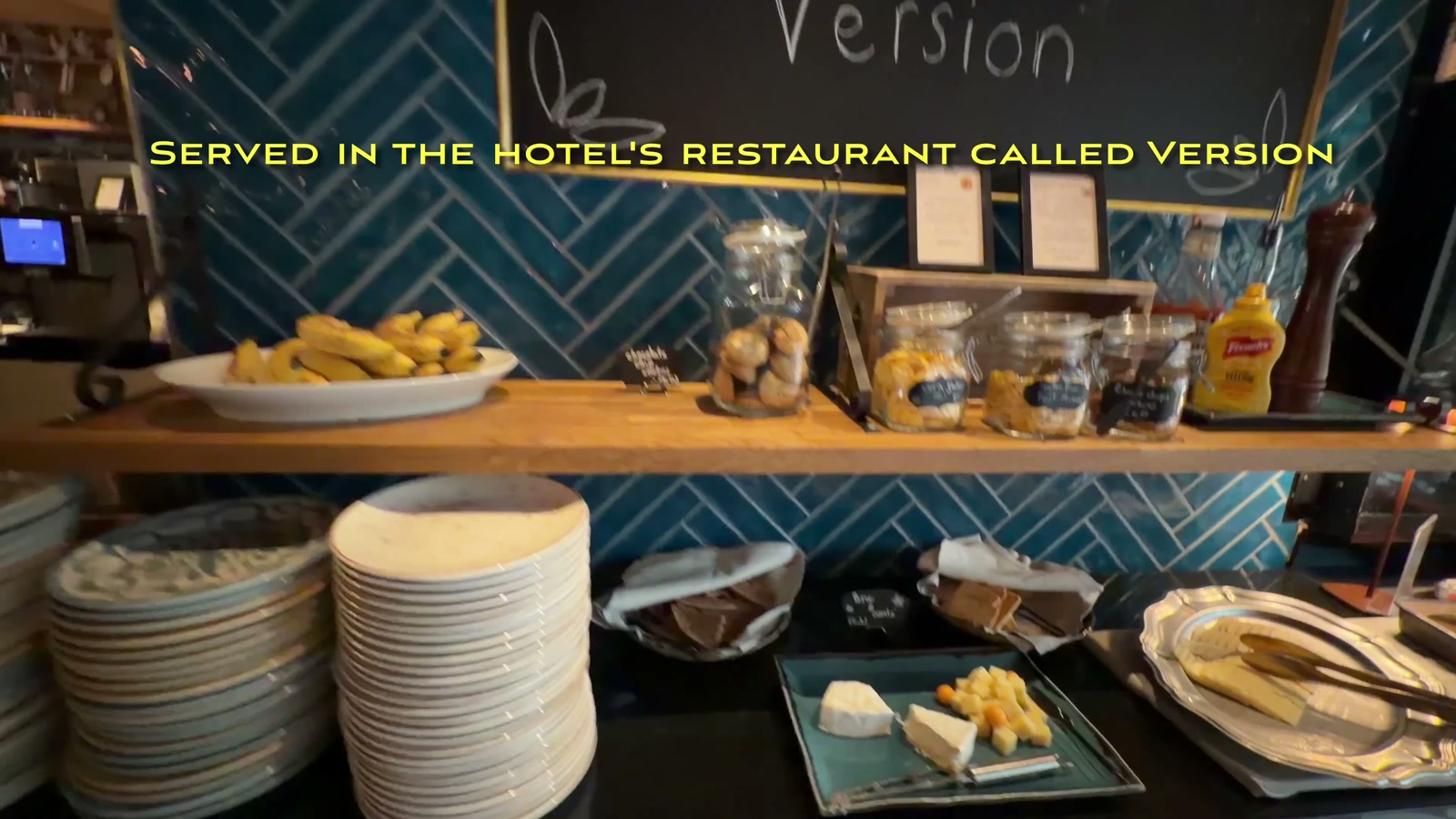 The “Welcome to our Version” chalkboard sign at the restaurant’s condiment station