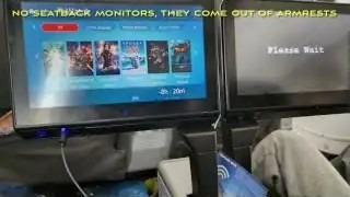 No seatback monitors β the screens come out of the armrests
