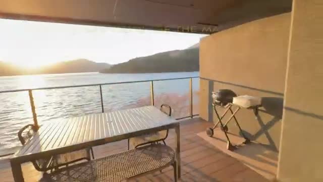 The big balcony with outdoor dining overlooking Lake Ashi at sunset