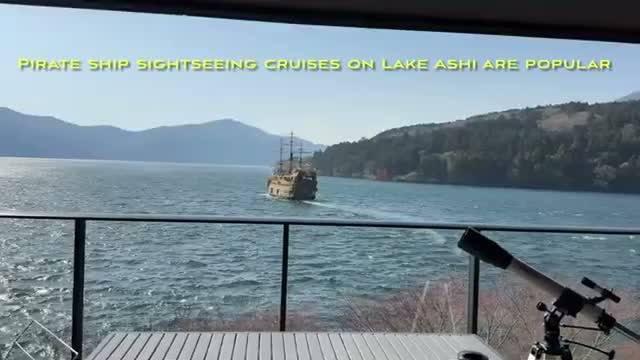 A pirate ship sightseeing cruise passing by, seen from the balcony
