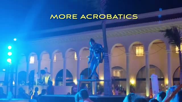 Cirque-style acrobats performing in the colonnade