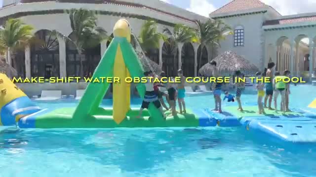 Inflatable water obstacle course in the pool
