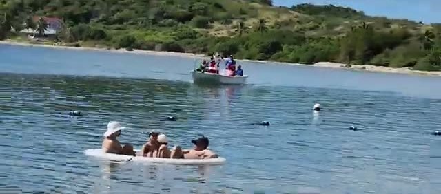 Santa arriving by boat on Christmas Day