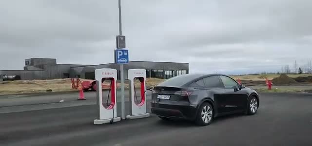 The Model Y charging at a Tesla Supercharger — “there are Superchargers all along the Ring Road”
