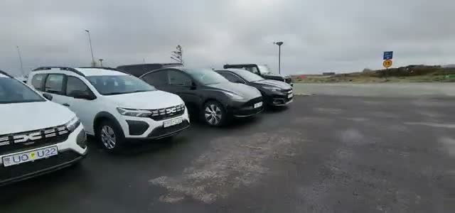 The black Tesla Model Y at the Europcar rental lot